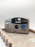 The Pentax PC-33 Silver Film Camera in Sliver